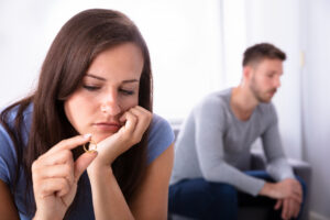 Upset Woman Holding Wedding Ring